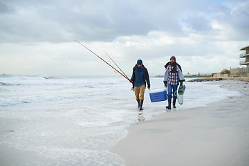 Image showing Water, fishing and men walking on beach together with cooler, tackle box and holiday conversation. Ocean, fisherman and friends with rods, bait and tools at waves on winter morning vacation at sea.