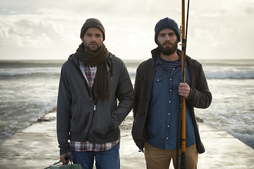 Image showing Fisherman, friends and serious with portrait for fishing in the morning by sea with waves, bonding or sky. Friendship, men and face with pride, overcast or rod by water for hobby, holiday or activity