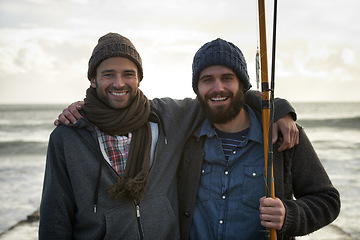 Image showing Fisherman, friends and hug with portrait for fishing in the morning by sea with happiness, bonding and sky. Friendship, men and face with smile, embrace or rod by water for hobby, holiday or activity