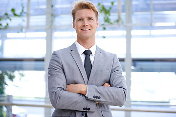 Image showing Office, portrait and businessman with arms crossed for happy in job, smile and professional worker in workplace. Accountant, positive and face with mission in corporate and formal suit for work