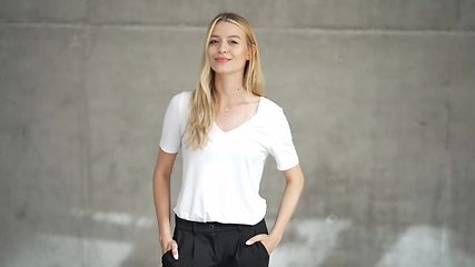 Image showing Confident Woman in Casual White T-Shirt Posing