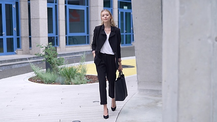 Image showing Confident Businesswoman Walking in Urban Setting