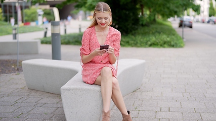 Image showing Young Woman Enjoying Summer Day in Urban Park