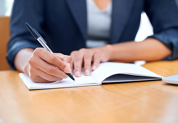 Image showing Hands, business and writing in book closeup, agenda and information in office. Journal, notes and fingers of professional secretary at desk with pen for reminder, schedule and planning project ideas