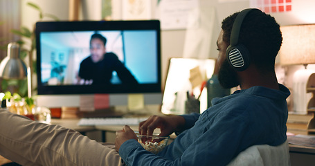 Image showing Computer, web vlog and man watching movie with snacks and food in home office. Relax, internet and African male person with film subscription app and tech with headphones listening to online video