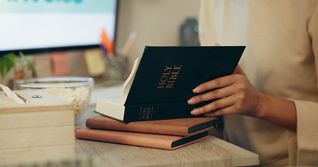 Image showing Bible, religion and hands of person reading holy Christian book to worship God for spiritual learning and trust. Faith, knowledge and person with peace due to scripture, praise and gratitude in home