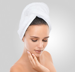 Image showing Woman, skincare and beauty in studio, confidence and proud of healthy skin on white background. Female person, towel and satisfaction for facial treatment, cosmetics and dermatology for grooming