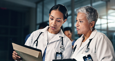 Image showing Doctor, women together and tablet in night, documents or analysis for results, decision or info in hospital. Mature medic, partnership and paperwork for healthcare, wellness and planning with choice