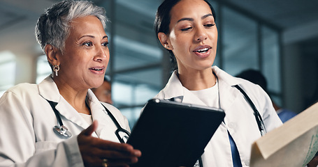 Image showing Doctor, women together and tablet with documents, night or analysis for results, decision or info in hospital. Mature medic, partnership and paperwork for healthcare, wellness or planning with choice