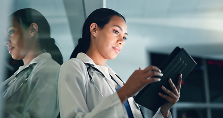 Image showing Doctor, woman and tablet at night with medical, healthcare and clinic data for research. Female professional, employee and telehealth with online consulting on a web app for wellness and planning