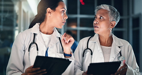 Image showing Doctors night planning and tablet with talking, medical data and research in a hospital with women. Working, online and diagnosis discussion for healthcare, wellness and clinic job with conversation