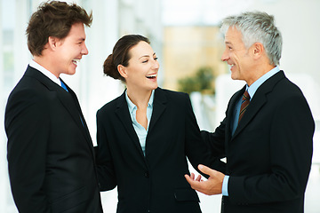 Image showing Team, laugh and together in workplace of corporate company with professional suits talking to boss. CEO, happy and discussion with employees in meeting of collaboration in workforce for business