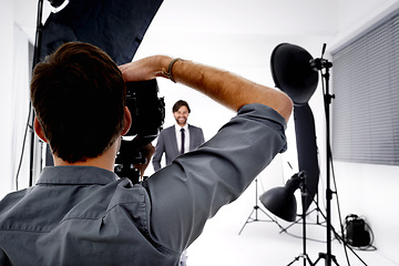 Image showing Back, model and photographer in studio, gear and pose with confidence and professional with equipment. Employee, freelancer and entrepreneur with lighting and campaign with style, tools and portfolio