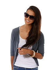 Image showing Studio, portrait and white background of woman with sunglasses, big smile and long hair. Indian model, gen z person and glow with trendy accessories for casual clothing, spring fashion and mock up