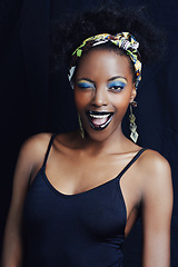 Image showing African woman, wink and studio for makeup, style and smile for eye shadow and glamour. Black female model, dark background and cosmetic, portrait and face for cultural, fashion and elegant earrings