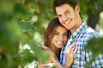 Image showing Portrait, happy young couple and hug in nature in the park and bonding outdoors in Italy. Love, relationship and travel with romantic partners, getaway date for holiday summer laughing with affection