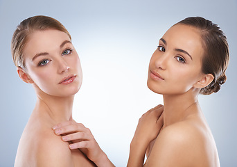 Image showing Woman, portrait and models in skincare with beauty, makeup or cosmetics on a blue studio background. Young female person or people with diversity in facial treatment, spa or salon on mockup space