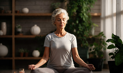 Image showing Serene Mature Woman Practicing Mindful Meditation Indoors