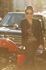 Image showing Bike, leather and woman in city with sunglasses for travel, transport or road trip as rebel. Fashion, street and model with attitude on classic or vintage motorcycle for transportation or journey