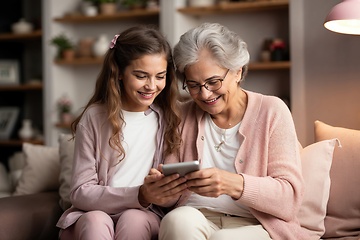 Image showing Grandmother and Granddaughter Enjoying Time with Tablet