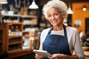 Image showing Senior Small Business Owner Managing Shop Inventory