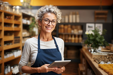 Image showing Confident Female Entrepreneur With Tablet in a Cozy Store