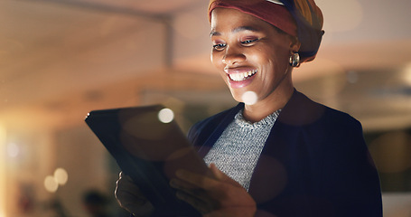 Image showing Business, happy black woman and tablet at night in office to search online report, scroll information and website planning. Corporate employee working late on digital data, tech or social network app