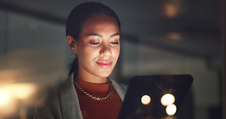 Image showing Business woman, smile and tablet at night in office to search online report, scroll information and website planning. Happy corporate employee working late on digital data, tech or social network app