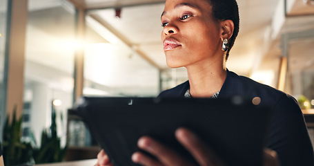 Image showing Business, black woman and tablet at night in office to search internet, scroll information and planning website. Face of serious employee working late on digital tech, online data or social media app