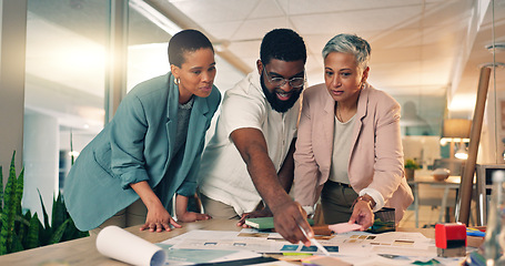 Image showing Discussion, planning and business people in office at night for a creative project with paperwork. Meeting, diversity and team of designers working overtime on research in collaboration for deadline.