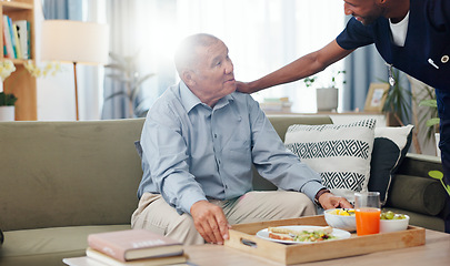 Image showing Senior, woman and nurse or breakfast with support, conversation and caregiver in living room of retirement. Elderly, person and black man with kindness, happiness and discussion while serving a meal