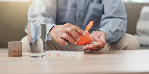 Image showing Hands, elderly person and pills on table with water, medicine for health and treatment for sick patient at home. Pharmaceutical drugs, supplements or antibiotics with daily routine for healthcare