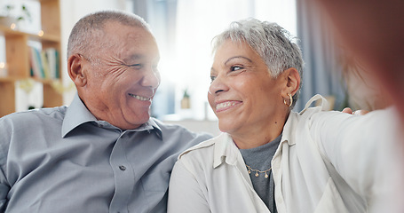 Image showing Senior couple, selfie and living room at home with smile, love and care together on a sofa. Social media, happy and face in a lounge with support and laughing in retirement with marriage on a couch