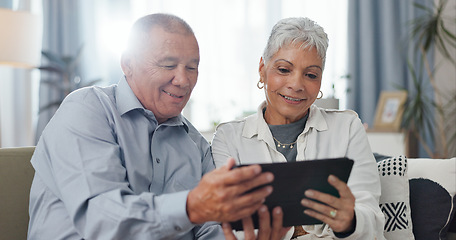 Image showing Senior, couple and tablet on sofa for online streaming, reading ebook or planning for retirement at home. Elderly people with digital technology for internet, happy with online choice and discussion