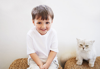 Image showing Child, boy and portrait with cat for pet, best friend and bonding with happiness in living room of home. Toddler, kid and face with animal, kitten and friendship in lounge of house or apartment