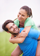 Image showing Fitness, couple and piggyback outdoor for workout break, happy and healthy with strength and endurance. People smile for wellness, exercise together in park with sports or training for bonding