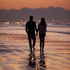 Image showing Silhouette, sunset and couple holding hands outdoor with back view and nature, travel and bonding for love and commitment. People walk on beach, trust and loyalty with adventure together and shadow