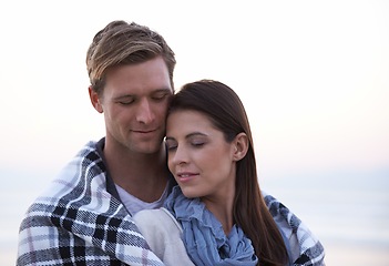 Image showing Couple, love and embrace outdoor with blanket together on holiday in Florida with sky background. Travel, vacation and man hug woman on date in summer with care, support and kindness in marriage