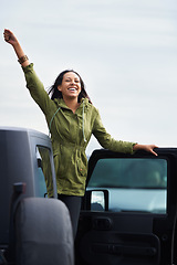 Image showing Happy woman, road trip and freedom with car for travel, drive or final stop at destination. Excited young female person with smile in satisfaction and leaning on vehicle door for outdoor adventure