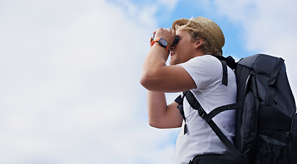 Image showing Man, hiker and binoculars with backpack for hiking, sightseeing or outdoor travel with blue sky background. Male person, traveler or tourist with bag or optical instrument for view, vision or scope