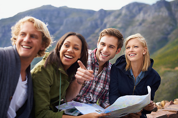 Image showing Happy people, friends and pointing with map for travel, location or destination on mountain in nature. Young group with smile, document or geographic paper for navigation, help or outdoor tourism