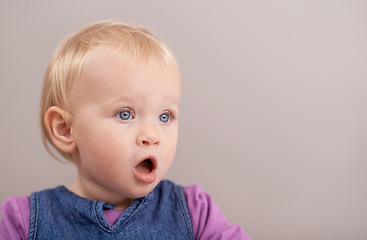 Image showing Children, wow and baby in studio with surprise, announcement or open mouth on grey background. Kids, mockup and girl face shocked by learning promo, news or child development, information or space