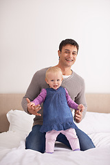 Image showing Portrait, love or father and baby on a bed happy, playing or bonding at home with morning games. Child development, learning and face of dad with girl in a bedroom for fun, support and family time