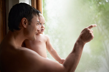 Image showing Rain, window or father and baby in house with glass, writing or art while bonding, playing or learning. Water, window or dad with kid at home for storm, watching or child development and drawing