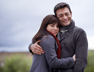 Image showing Love, smile and hug with couple in countryside together for weekend bonding or romantic date. Environment, nature or park with man and woman embracing outdoor for safety, security or trust in morning