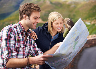 Image showing Happy couple, map and travel with location, destination or coordinates on mountain in nature. Young man and woman with smile, document or paper with routes for navigation, help or outdoor tourism