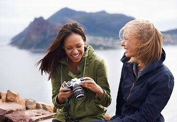 Image showing Happy woman, friends and laughing with camera for funny joke, photography or moments together in nature. Female person with smile for photo, picture or memories of fun outdoor holiday or adventure