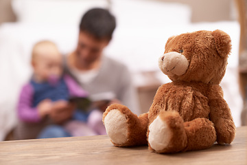 Image showing Love, reading or father and baby with book in a bedroom for reading, bonding or playing with teddy bear blur. Family, learning and dad teaching kid with storytelling, fantasy or security in a house