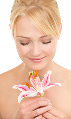 Image showing Flower, natural beauty and woman for skincare, organic cosmetics with nature and glow on white background. Tiger lily, eco friendly treatment for skin and dermatology with sustainability in studio