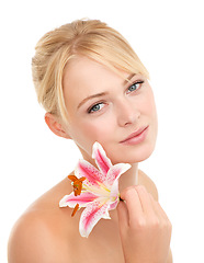 Image showing Skincare, flower and portrait of woman in studio with natural, health and wellness face routine. Cosmetic, beauty and person with floral plant for facial dermatology treatment by white background.